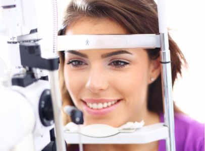 Woman getting a contact lens exam in NJ Woman getting a contact lens exam in NJ
