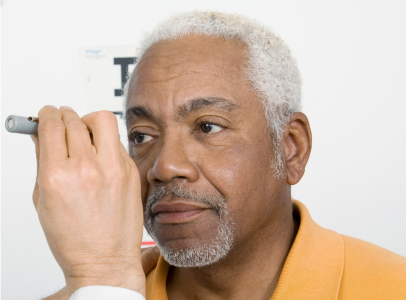 Man getting a diabetic eye exam Man getting a diabetic eye exam