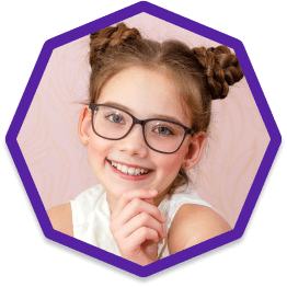 Child smiling wearing new eyeglasses Child smiling wearing new eyeglasses