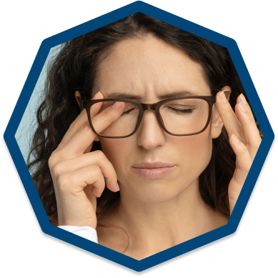 Woman rubbing eyes suffering from dry eye symptoms Woman rubbing eyes suffering from dry eye symptoms